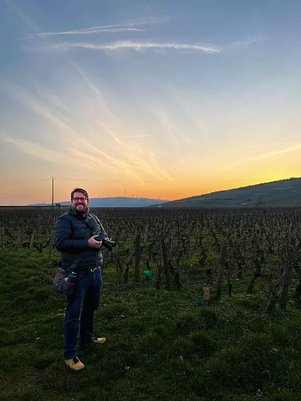 Photographer Greg Brown on location for a sunset photoshoot in a vineyard